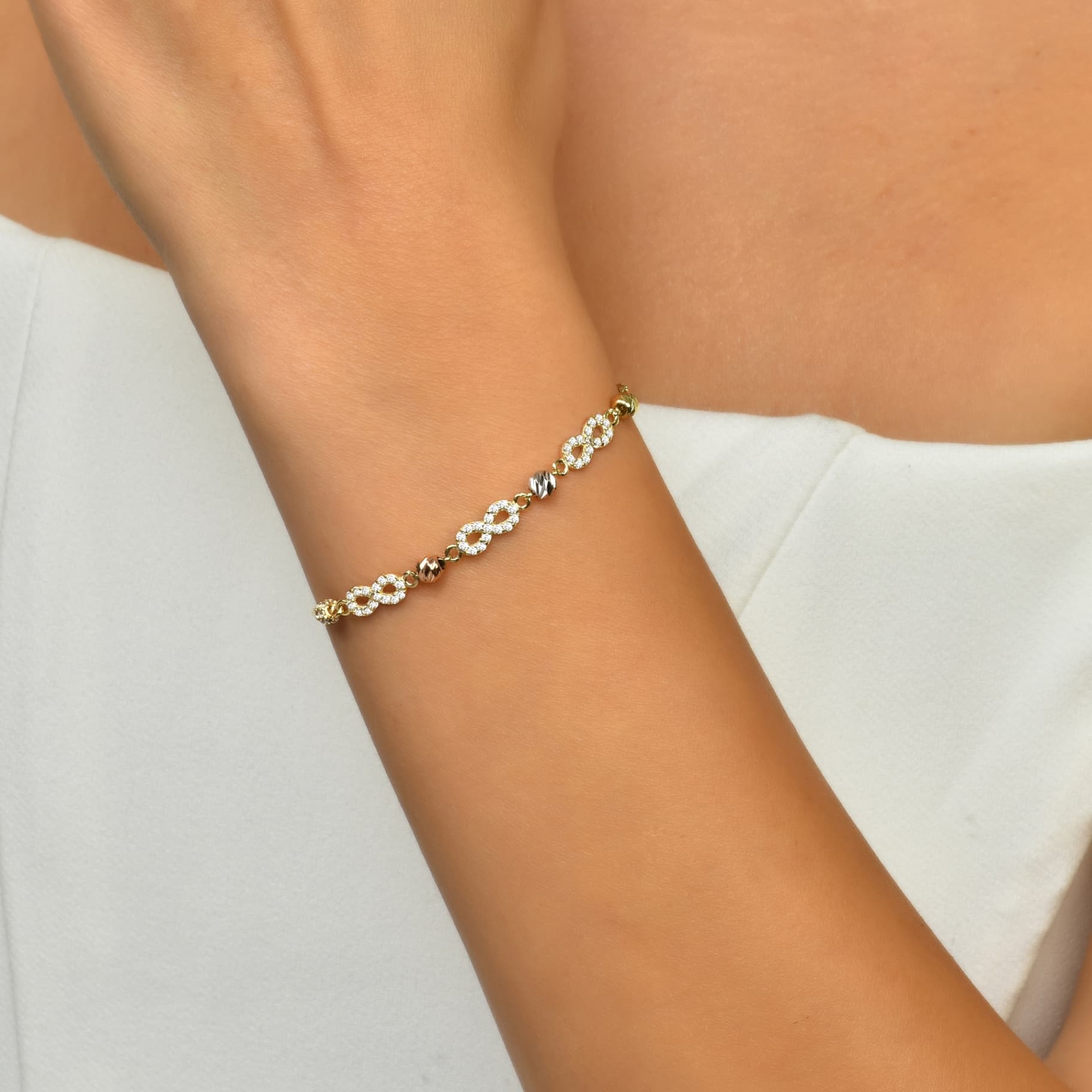 Гривна от жълто, бяло и розово злато, символ безкрайност с бели цирконий - Image 2